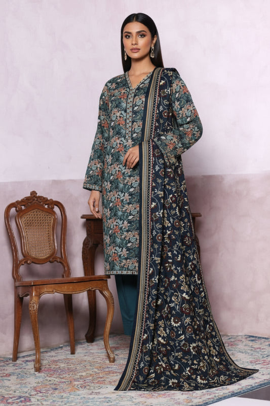 Floral patterned outfit on a woman model with a pink wall and wooden chair in the background