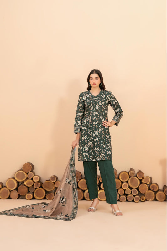 Woman in a floral outfit with a matching dupatta against a beige background with wooden logs.