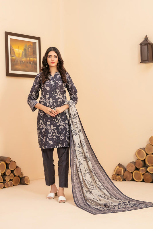 Woman in a floral outfit with a long scarf in a decorated room.