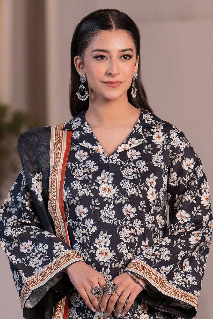 Woman wearing a floral dress with a dark background