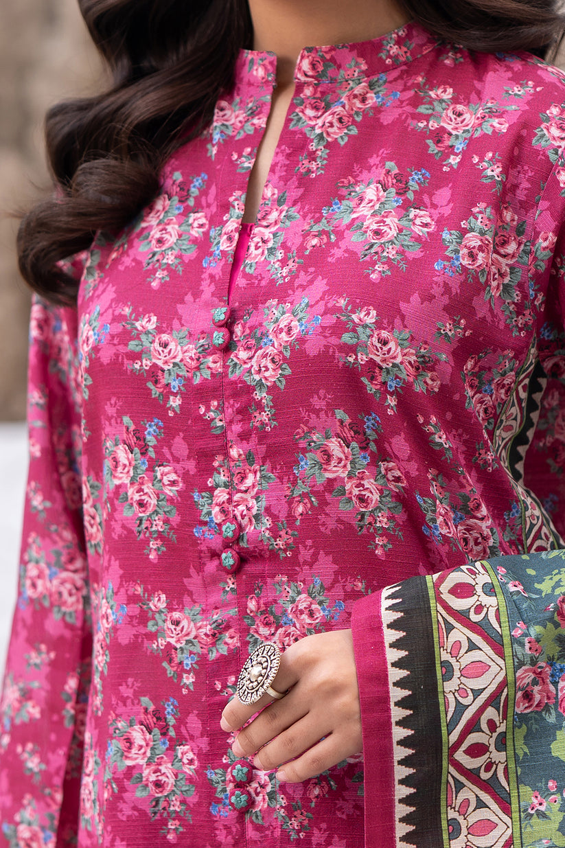 Close-up of a pink floral dress with intricate patterns.