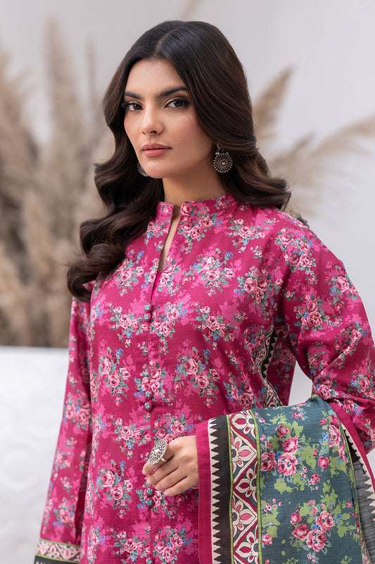 Woman wearing a pink floral dress with a matching dupatta against a neutral background