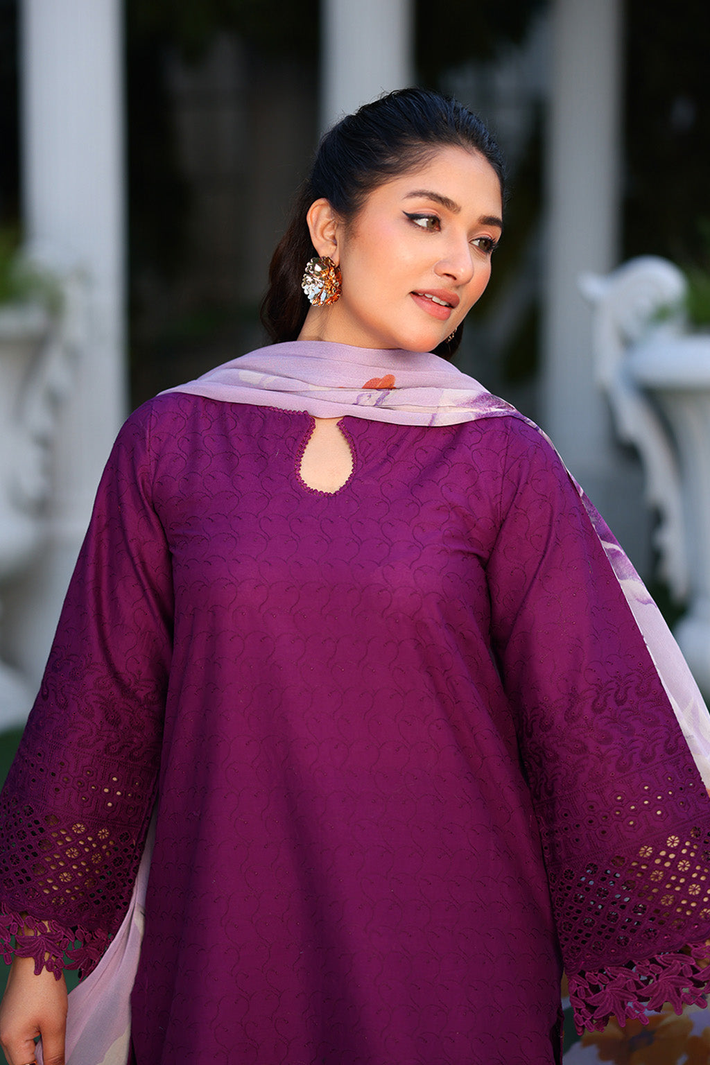  lawn suit with delicate threadwork, paired with a lightweight printed bamber chiffon dupatta – perfect for hot weather occasions